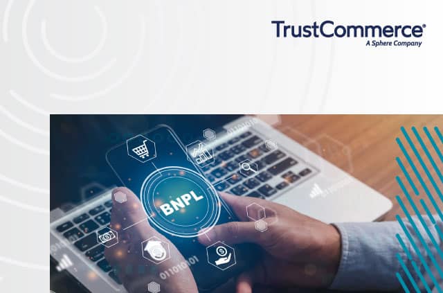 Person holding a phone where the screen says "BNPL" Buy now, pay later