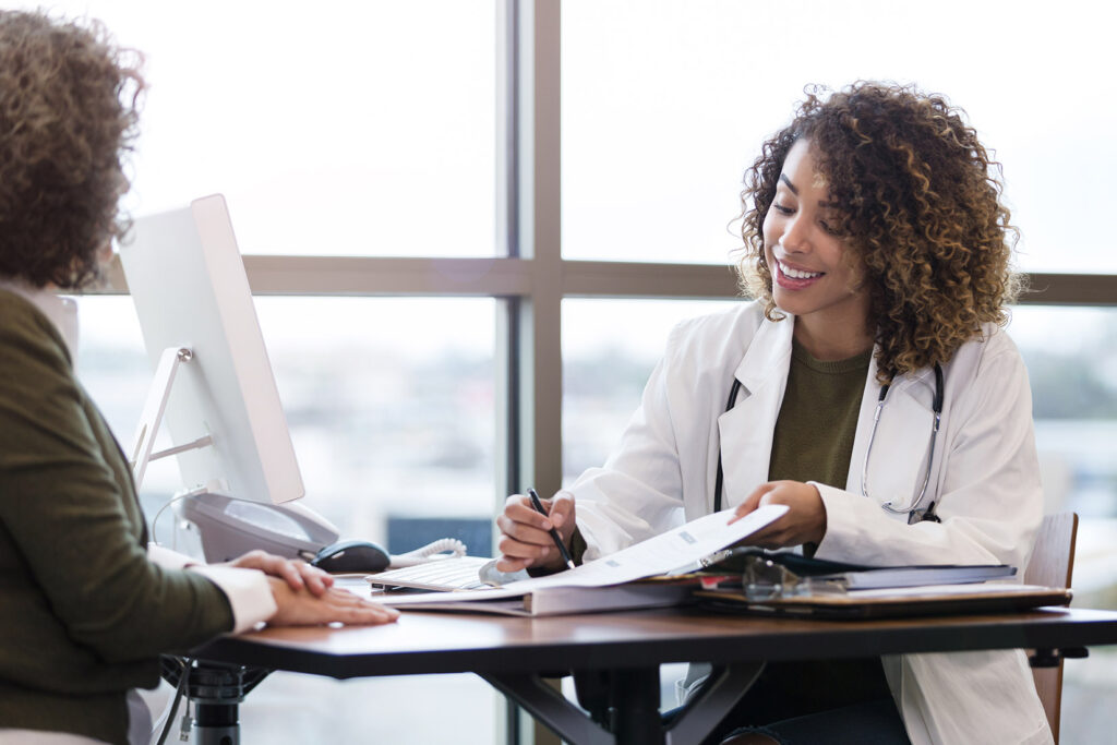 an image of a female doctor reviewing results with a patient